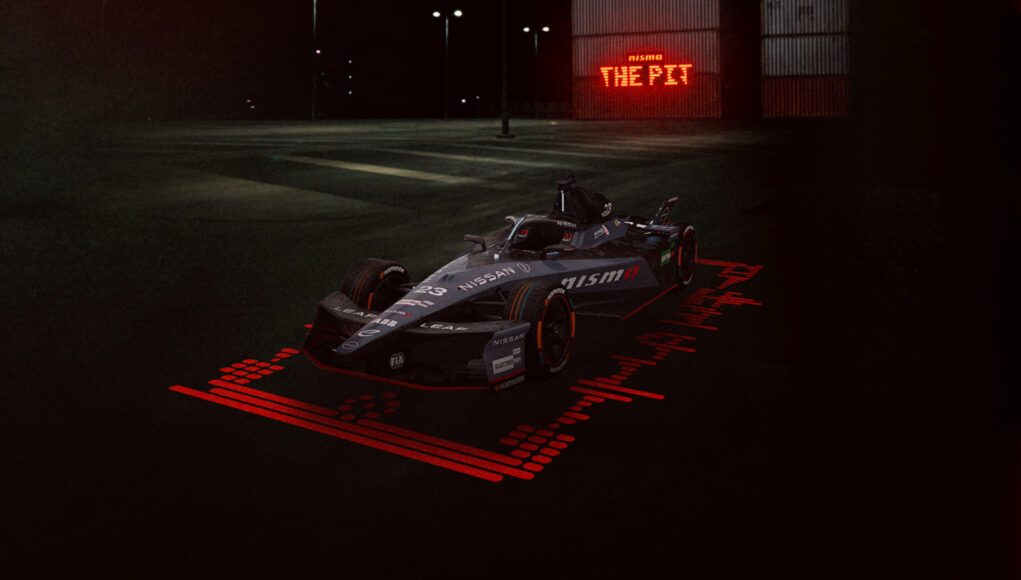 Nissan Formula E Team S12- Tokyo E-Prix Preview Landscape front/side on image of the #23 Nissan e-4ORCE 05 with the unique one-off NISMO livery on the car, with 'The NISMO Pit' branding in the background.