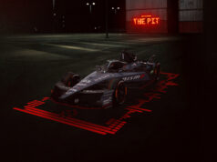 Nissan Formula E llega a Tokio con la presión del campeonato y el orgullo de correr en casa Landscape front/side on image of the #23 Nissan e-4ORCE 05 with the unique one-off NISMO livery on the car, with 'The NISMO Pit' branding in the background.