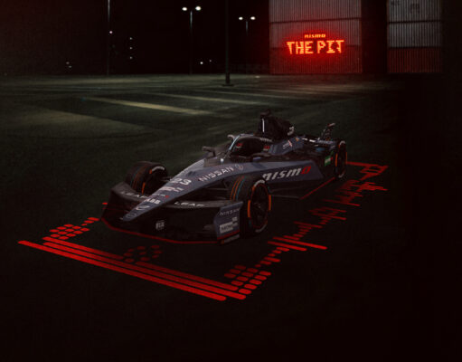 Nissan Formula E llega a Tokio con la presión del campeonato y el orgullo de correr en casa Landscape front/side on image of the #23 Nissan e-4ORCE 05 with the unique one-off NISMO livery on the car, with 'The NISMO Pit' branding in the background.